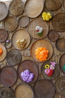 Various bamboo baskets with colourful flowers on a traditional background, Pattaya, Thailand, Asia