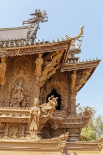 Detailed carvings and figures on a part of the wooden temple, artistically decorated, Pattaya,