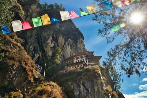 View of Taktshang Monastery through prayer flags