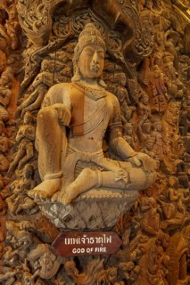 Wooden sculpture of the God of Fire in a magnificently decorated temple, Pattaya, Thailand, Asia