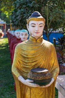 Long row of monk statues at Kaw Ka Thaung cave