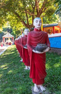 Long row of monk statues at Kaw Ka Thaung cave