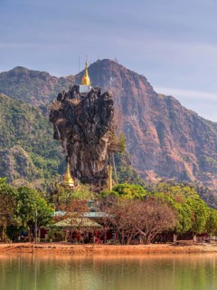 Amazing Buddhist Kyauk Kalap Pagoda under afternoon sky