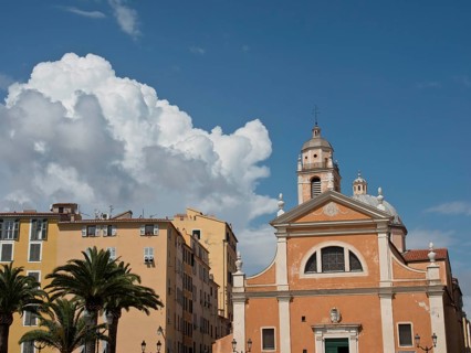 Church and surrounding buildings under a partly cloudy sky, ajaccio, corsica, france