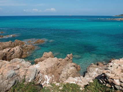 Rocky coastline with clear turquoise water and lush nature, ajaccio, corsica, france