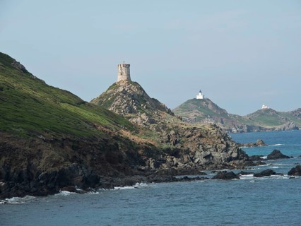 Rocky coastal landscape with two lighthouses on green hills, ajaccio, corsica, france