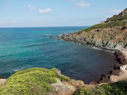 Seascape with rocky cliffs and green vegetation, ajaccio, corsica, france