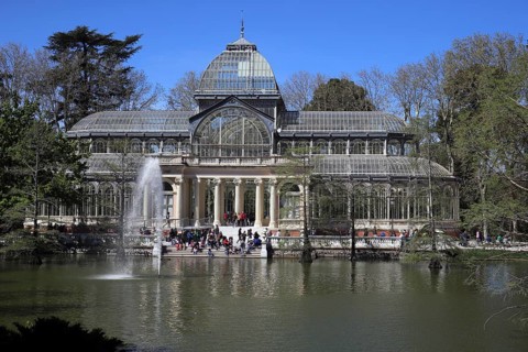 Palacio de Cristal, Parque del Retiro, Spain Crystal palace surrounded by spring green. Front view