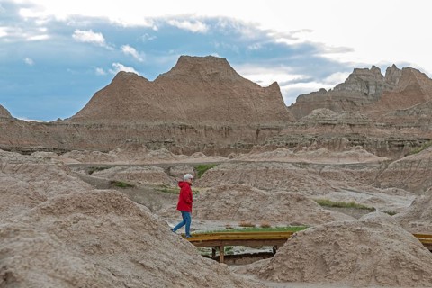 Badlands National Park, South Dakota. Susan Newell, 75, hikes on a boardwalk