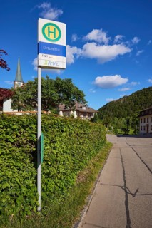 Bus stop in the centre of the 7321 bus route with St. Wendelin church in the historic district of