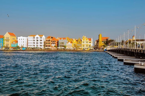 View from district Otrabanda over bay St. Anna bay Sint Annabaai to landmark Handelskade houses in