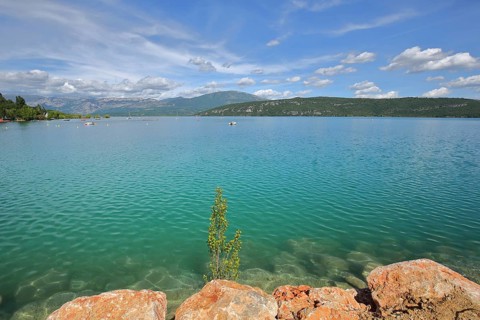 Stones on the shore of the reservoir Lac de Sainte-Croix near Sainte-Croix-du-Verdon, landscape,