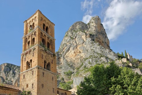 Church tower of Notre-Dame-de-l'Assomption and rock with Notre-Dame de Beauvoir church, cliffs,
