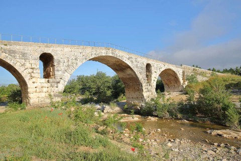 Roman stone arch bridge Pont Julien built 3rd century over the river Calavon, Roman bridge, Roman