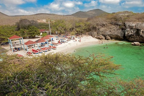 View from elevated position on small sandy beach Playa Lagun in bay on Caribbean Sea, Caribbean,