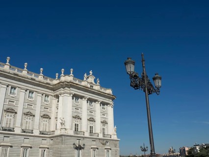 Magnificent wing and wrought-iron lanterns under a bright blue sky, Madrid, Spain, Europe