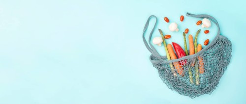 Mesh bag with vegetables, shopping grocery, healthy food ingredients, asparagus sprout, mushrooms,