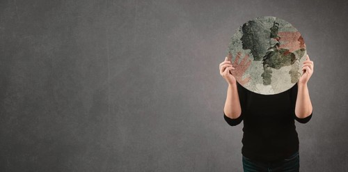 Domestic violence, hand hits face of abused woman, international awareness month october for