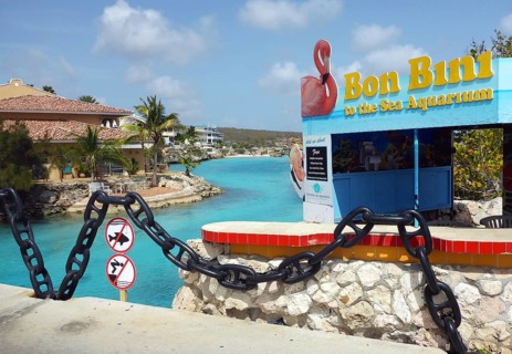 Sign with on island in country Curacao typical welcome greeting Bon Boni in entrance area of Sea