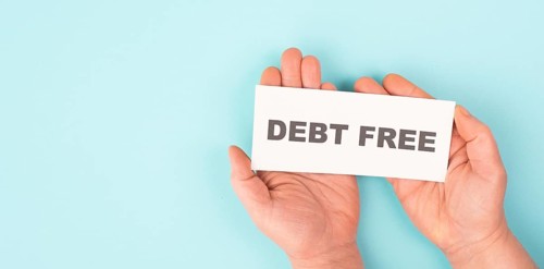 Debt free in process, ending credit payments and bank loans, financial freedom, message on paper