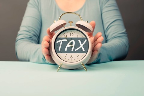 Tax time, alarm clock for taxation, deadline for payment, financial income, return of taxes