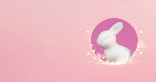 Curious easter bunny or rabbit peeking through a hole, holiday in spring, greeting card with little