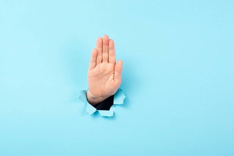 Hand waving, saying hello, friendly gesture, high five or stop sign, communication, torn paper hole