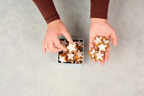 Cinnamon stars, Zimtsterne traditional german christmas cookies in a box, gingerbread with anise