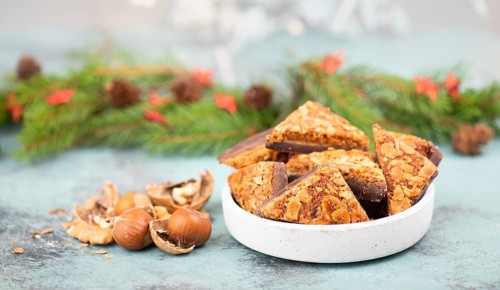 Nut corner triangles, traditional german sweets called Nussecke, covered with chocolate, christmas