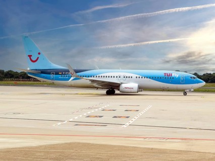 Boeing 737-800 of TUIfly taxiing on Taxi Way taxiway to runway of Düsseldorf International Airport,