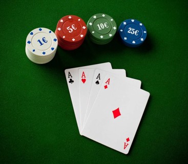 Poker concept with cards on green table