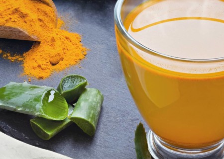 Drink aloe vera and turmeric. Glass cups on a slate tray