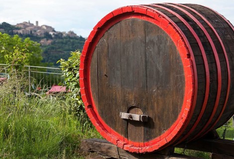 Wine barrels and the hilltop town of Montepulciano, Tuscany, Italy, Europe
