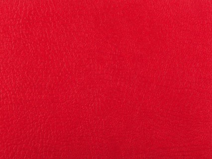Abstract texture of synthetic leather, red background