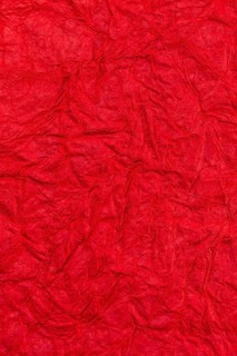 Background surface of wrinkled red and crumpled paper