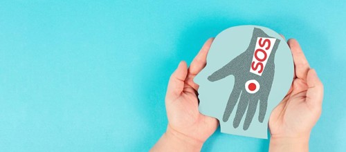 Domestic violence, hand hits face, sos on exclamation mark, international awareness month october