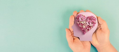 Brain with heart of flowers, love and passion, self esteem and mental health care concept, positive