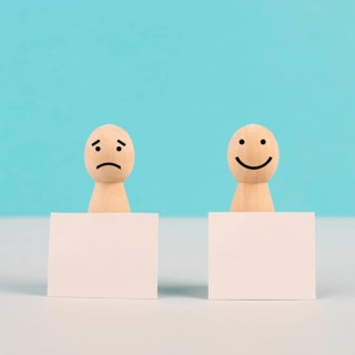 Man with a sad and a happy face holding empty signs, positive and negative mindset, support and