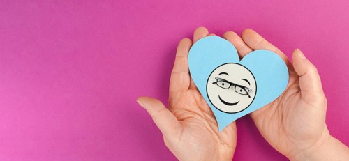 Heart with a smiling face and eyeglasses, mental health concept, positive mindset, support and