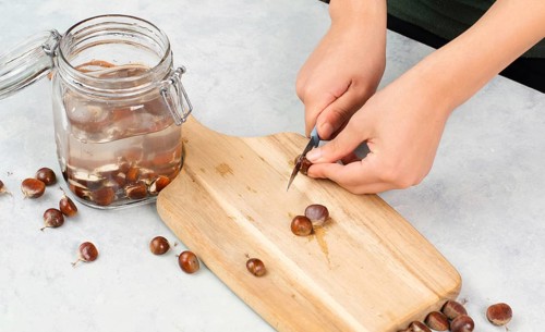 Preparing chestnut liquid soap, cutting buckeye and putting it into a jar with water, alternative