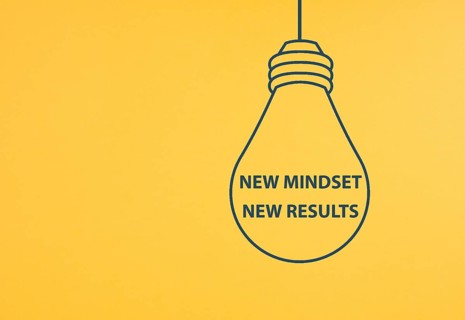 New mindset new results is standing in the light bulb, coaching strategy, optimistic and positive