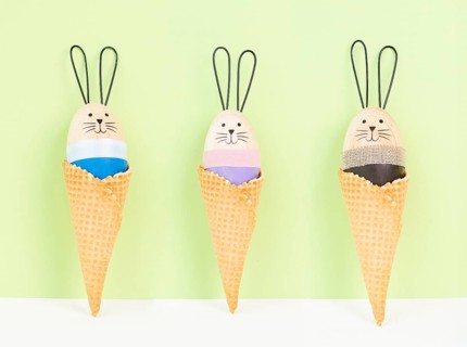Cute easter bunny or rabbit in an ice cream cone, spring holiday, greeting card