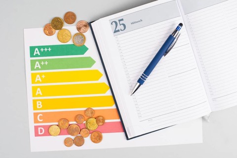 Energy crisis, calendar with a pen and power consumption, increasing prices, high living expenses,