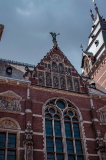Historic Gothic façade of the Rijksmuseum made of bricks with decorations, Amsterdam, Netherlands