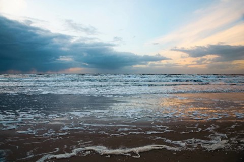 Wadden sea at low tide, North sea beach landscape, coast on Romo island in Denmark at sunset,