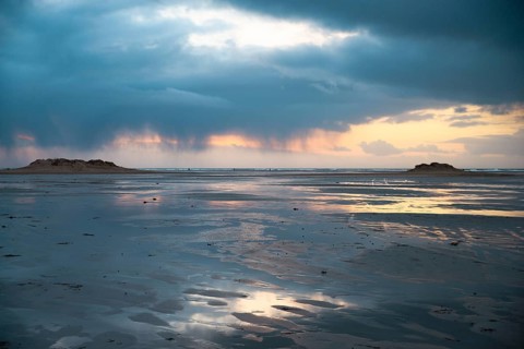 Wadden sea at low tide, North sea beach landscape, coast on Romo island in Denmark at sunset,