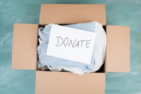 Package with used clothes for donation, second hand use for poor people, welfare and support