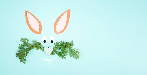 Easter bunny face, heart shaped nose, whiskers from carrot leaves, holiday greeting card, spring