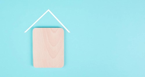 Wooden house with a roof, planning to build or rent a new home, real estate, owning property