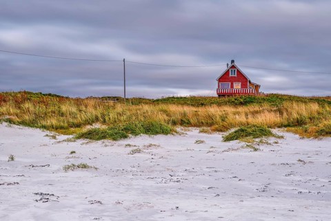 House on Hvit beach in Eggum, Rorbur, Bostad, Vestvagoy, Lofoten, Nordland, Norway, Europe
